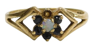 Lot 129 - A 9ct gold opal and sapphire flower head ring,...