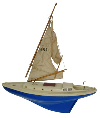 Lot 568 - A Penguin pond yacht and sail, with blue hull.