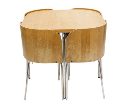 Lot 910 - An oak and laminate topped dining table, and...