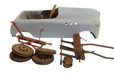 Lot 848 - A reprimed child's pedal car, dismantled,...
