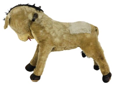 Lot 183 - A mid century Chiltern Toys ride on donkey,...