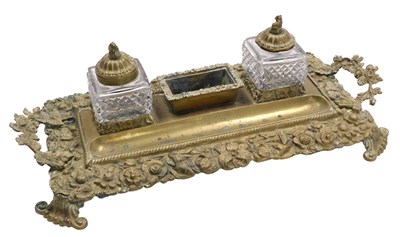 Lot 142 - A late 19thC brass desk stand, of twin handled...