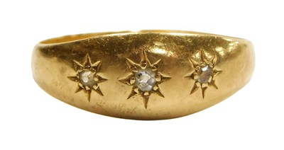 Lot 102 - An 18ct gold and diamond three stone gypsy...