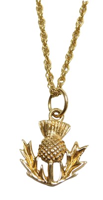 Lot 104 - A 9ct gold thistle pendant, on a fine double...