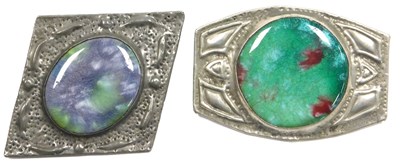 Lot 303 - Two Arts & Crafts pewter brooches, each inset...