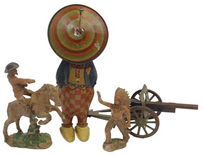Lot 518 - Four various toys, comprising a tinplate clown,...