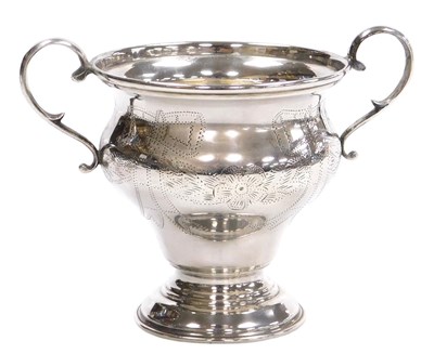 Lot 202 - A George V silver twin handled trophy, of ogee...