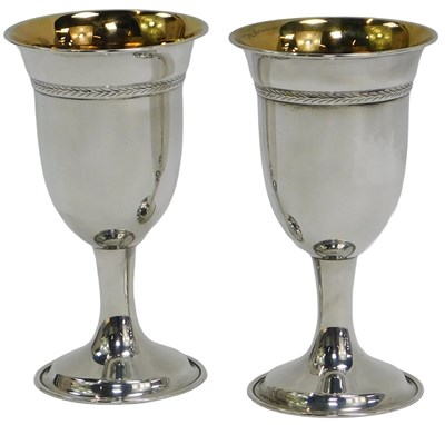 Lot 18 - A pair of Elizabeth II silver goblets, each...