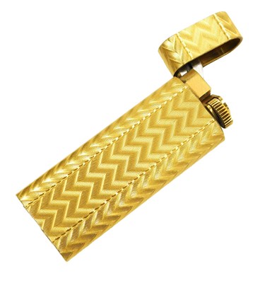 Lot 286 - A Cartier gold plated pocket lighter, with...