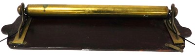 Lot 287 - An early 20thC brass wall mounted towel rail,...