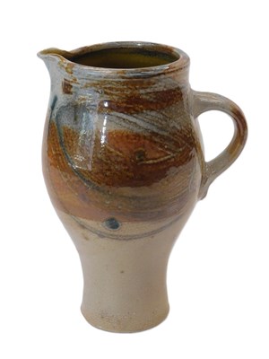Lot 230 - Mick Casson. A brown stoneware jug, impressed...