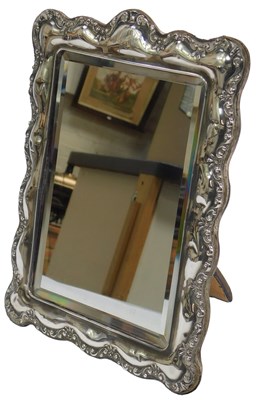 Lot 44 - An Edward VII silver mounted mirror, with a...