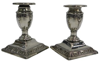 Lot 48 - A pair of Victorian silver squat candlesticks,...