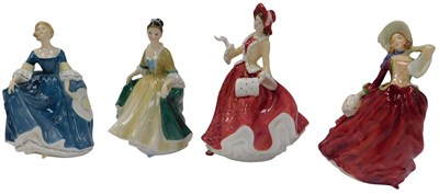 Lot 131 - Four Royal Doulton porcelain figures, modelled...