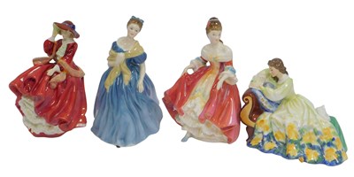 Lot 136 - Four Royal Doulton porcelain figures, modelled...