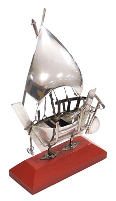 Lot 328 - A silver model of a Dhow, on a cradle stand...