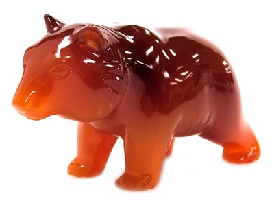 Lot 331 - A red agate carving of a polar bear, 7cm wide.