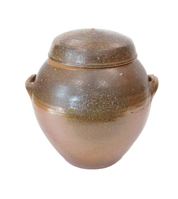 Lot 240 - A Studio pottery brown stoneware jar and cover,...