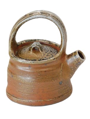 Lot 241 - A Studio stoneware salt glazed teapot, in...