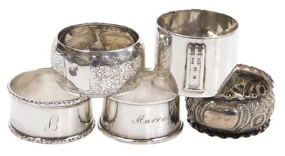 Lot 369 - Five silver napkin rings, one embossed with a...