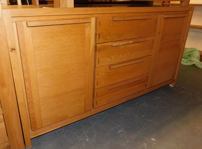 Lot 1002 - A contemporary oak sideboard, with three...