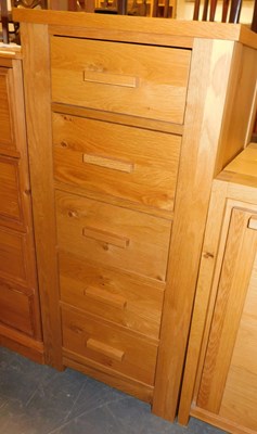 Lot 1003 - A contemporary oak narrow chest, of five...