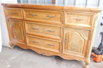 Lot 1004 - A 20thC oak sideboard, with three central...