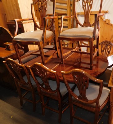 Lot 1015 - A 20thC yew extending twin pedestal dining...