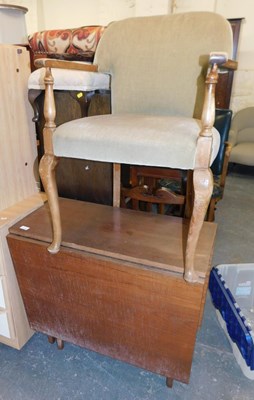 Lot 1080 - A teak drop leaf table, together with an open...