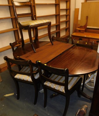 Lot 1121 - A mahogany extending twin pedestal dining...