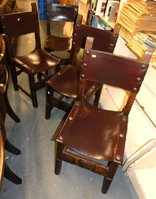 Lot 1122 - A set of four oak dining chairs, each with a...