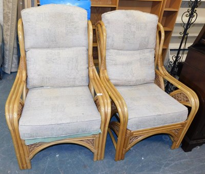 Lot 1125 - Two cane conservatory chairs, with loose seats...