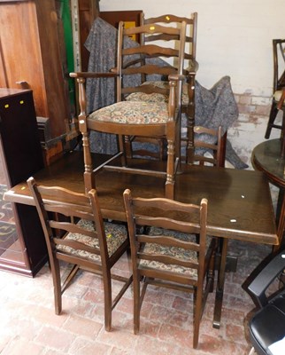 Lot 1047 - A dark elm trestle type dining table, 74cm...