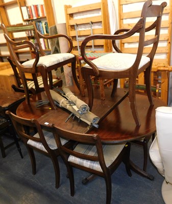 Lot 1131 - A mahogany extending twin pedestal dining...