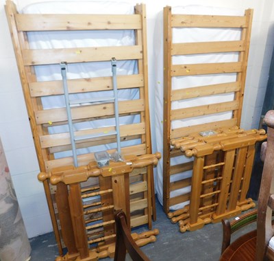 Lot 1135 - A pine bunk bed, with two mattresses.