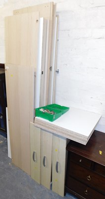 Lot 1082 - A 20thC wardrobe, unassembled.