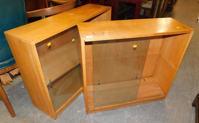 Lot 1098 - Two oak cabinets, each with sliding glass...