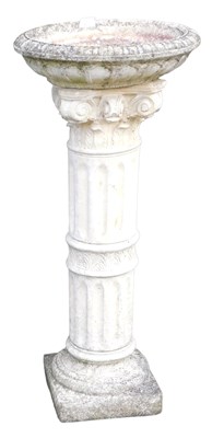 Lot 400 - A reconstituted stone pedestal birdbath, with...