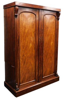 Lot 637 - A Victorian mahogany linen press, the pediment...