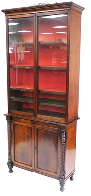 Lot 419 - An early Victorian mahogany cupboard bookcase,...