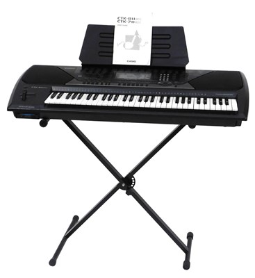 Lot 439 - A Casio Touch Response electric keyboard,...