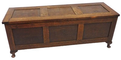 Lot 465 - An early 20thC oak coffer, raised on cabriole...