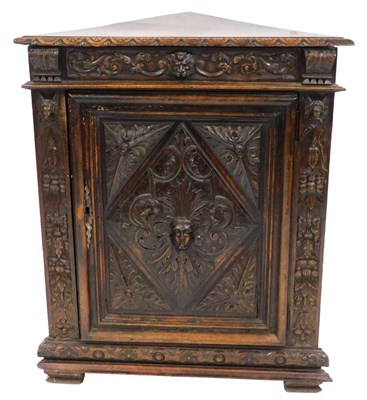 Lot 474 - A Victorian oak corner cupboard, profusely...