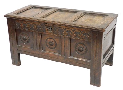 Lot 475 - A 17thC oak coffer, with a triple panelled lid,...