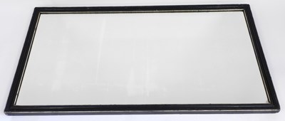 Lot 2235 - A rectangular wall mirror, in a painted black...