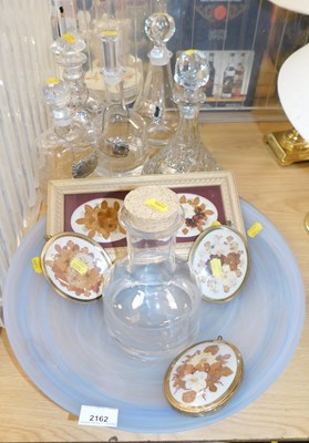 Lot 2162 - Five glass decanters, each with plated labels,...