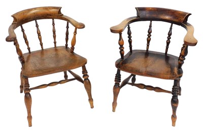 Lot 487 - Two Victorian smoker's bow chairs, one...