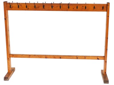 Lot 495 - A vintage pine school coat rack, of...