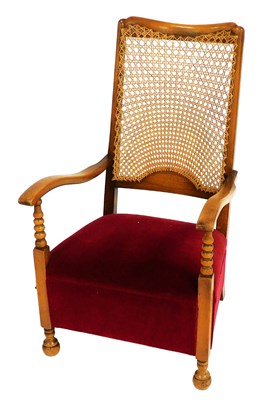 Lot 521 - An early 20thC beech and cane back nursing...