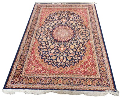 Lot 532 - An Isfahan blue ground silk rug, with a...